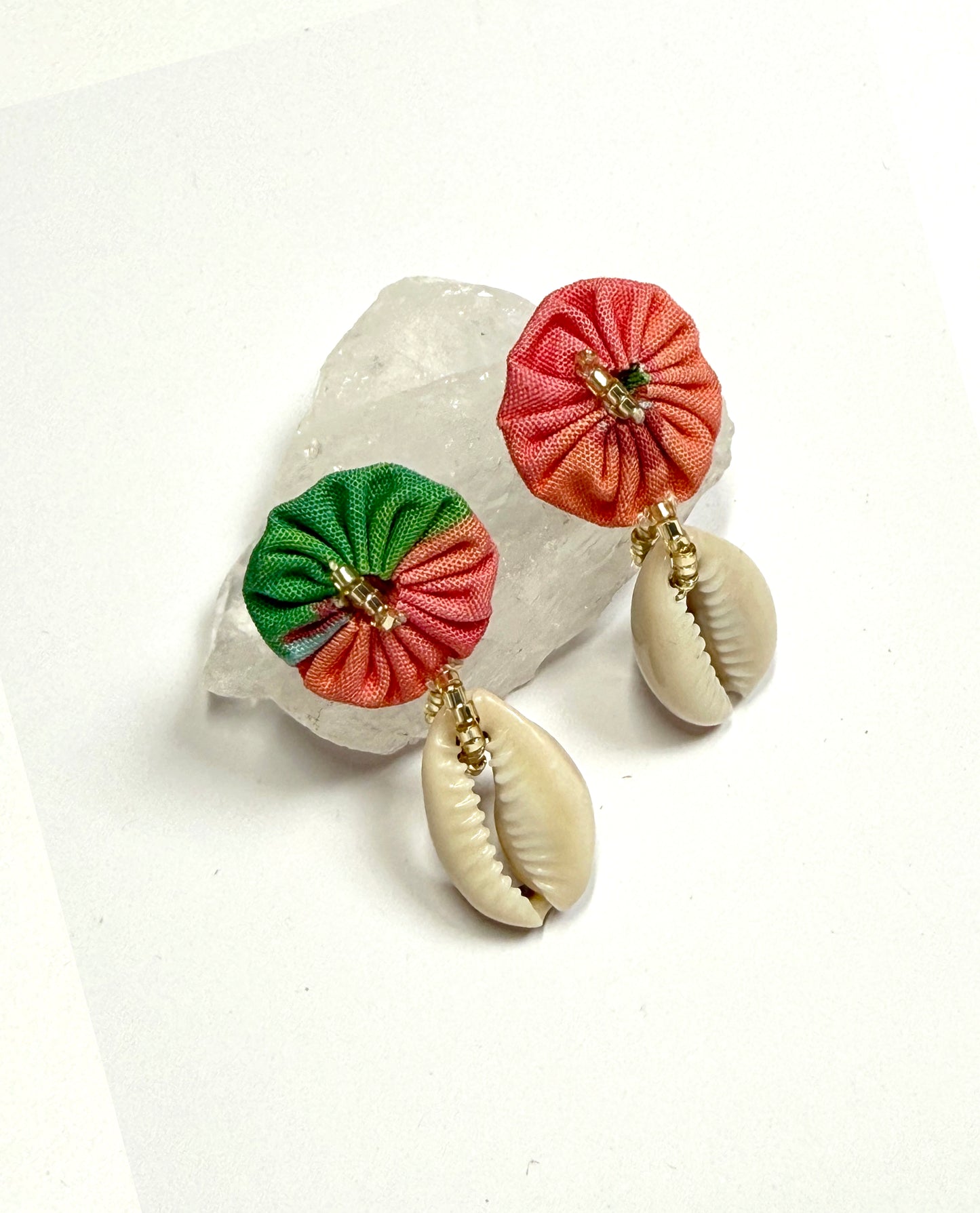 Puces coquillages roses